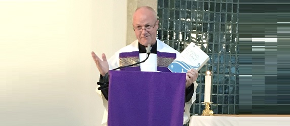 Revd Stephen Miller presenting a book on Maritime Mission in Hong Kong